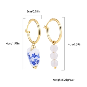 Detailed view of Chinese porcelain heart earrings with size measurements and weight info