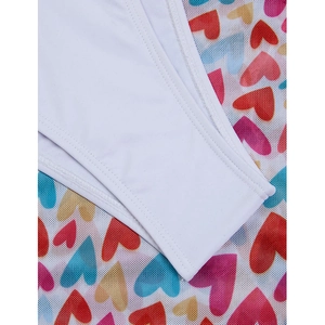 Detail of white bikini stitching and mesh fabric featuring colorful heart patterns