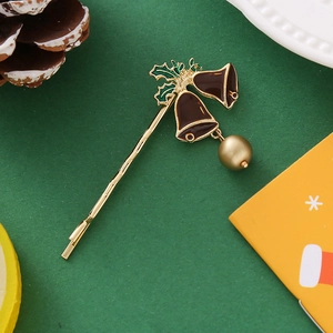 Barrette de Noël avec cloche rouge et feuilles de houx sur fond vert texturé