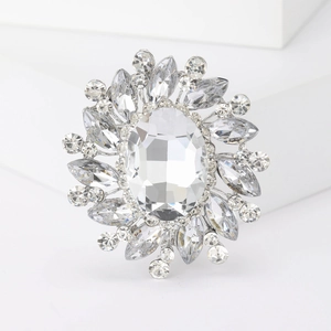 Exquisite silver-tone flower brooch with a large oval crystal and brilliant marquise rhinestones