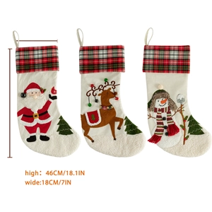 Set of three linen Christmas stockings with Santa, reindeer and snowman embroidery