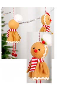 Detail of gingerbread man ornament with striped scarf and red-white rope on Christmas tree