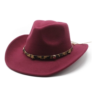 Detail of burgundy wool cowboy hat featuring a leopard print band and gold star studs