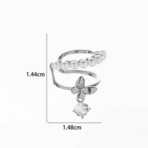 Macro detail of butterfly ear cuff with pearls and zircons measuring 1.44cm by 1.48cm