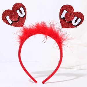 Close-up of red sequined heart headband with fluffy feathers and I Love You lettering