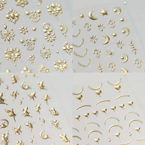 Champagne gold star and moon angel nail art stickers with metallic finish on neutral grey
