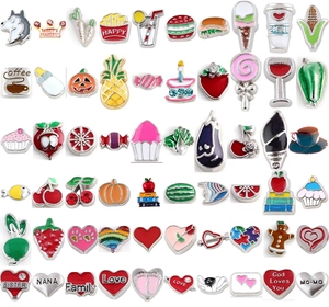 Macro shot of assorted colorful alloy floating charms with fruit and letter patterns