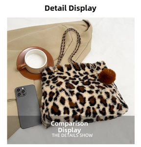 Detail of leopard print faux fur bag with gold chain strap and fuzzy pompom charm