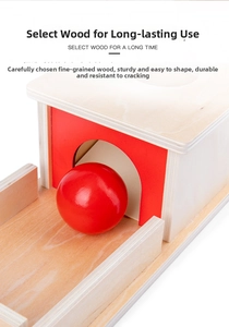 Close-up of durable Montessori wooden box with red panel and solid wood ball toy