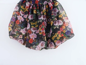 Detail view of the floral organza bubble hem on this black sweet mini puff skirt