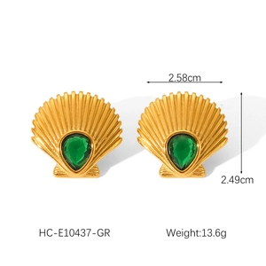 Detailed view of gold shell earrings with green zircon and size measurements