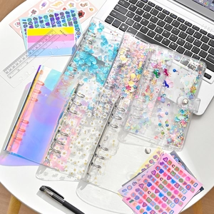 Detailed view of A6 PVC binder covers with 6-ring metal clips and glitter sequins