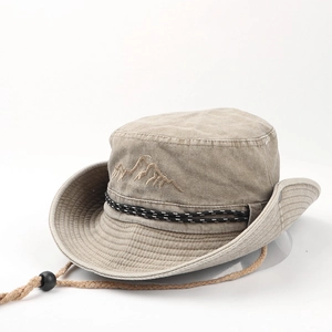 Detail of khaki outdoor bucket hat with mountain embroidery and woven windproof rope