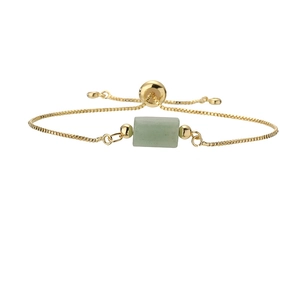 Detail of adjustable gold box chain bracelet with green stone and sliding closure