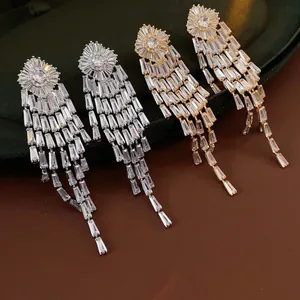 Elegant gold and silver long tassel earrings with baguette-cut cubic zirconia stones