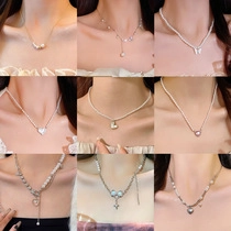 Detailed grid view of diverse pendant necklaces with pearls, hearts and butterflies