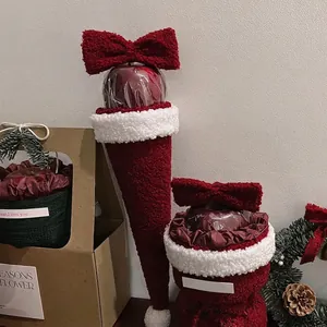 Christmas lamb wool apple gift box with red velvet stocking and festive craft materials
