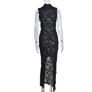 Close-up of distressed ripped texture and fringe detail on black sleeveless maxi dress