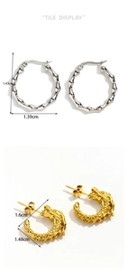 Flat lay of silver bamboo-style hoops and golden dragon-embossed C-shaped earrings