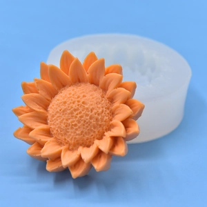 Sunflower silicone mold for resin craft with detailed orange 3D flower sample on blue background