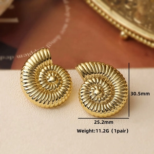Macro view of gold snail shell earrings with dimensions 30.5mm by 25.2mm and weight