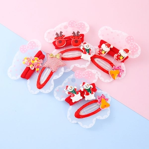Kids Christmas hair clip set with cartoon reindeer and snowman on pink-blue background