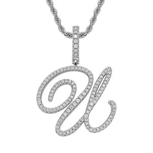 Macro view of silver U-shaped hip hop pendant with micro-pave cubic zirconia stones