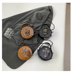 Mini round leather bags with skull and cross patterns featuring metal chain straps