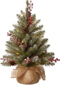 Detail of 60cm mini Christmas tree with snow flocked needles, red berries, and pine cones