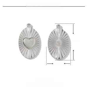 Detailed macro view of 20mm stainless steel oval pendant with heart relief and radial texture
