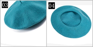 Close-up detail of a vintage wool beret in teal, showing soft texture and stitching