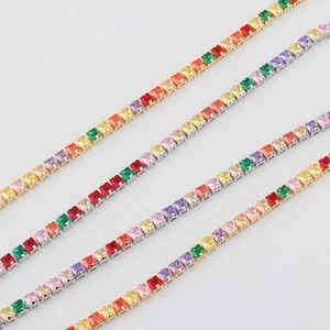 Colorful zircon chokers in gold and silver settings on a clean white background