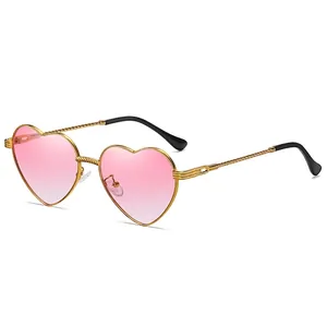 Fashionable heart-shaped sunglasses with pink gradient lenses and gold metallic twisted frame