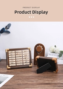 Detail of walnut wood jewelry display set with ring slots and soft beige velvet lining