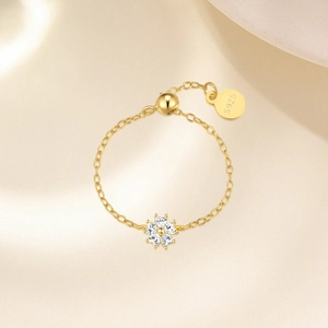 Close-up of S925 sterling silver chain ring with golden kite-shaped zircon butterfly