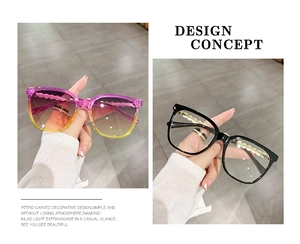 Detail showing square frame sunglasses with golden wavy temples and pearl chain accents