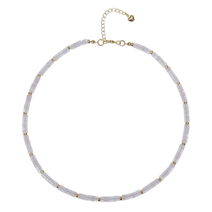 Detail showing lavender square beads with golden metal spacers and a heart charm