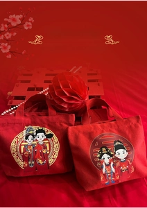 Detail of red wedding canvas bags featuring cartoon bride and groom with Double Happiness