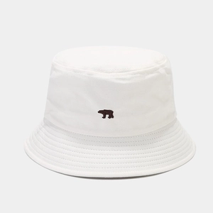 Detailed close-up of white cotton bucket hat featuring a brown bear embroidery design