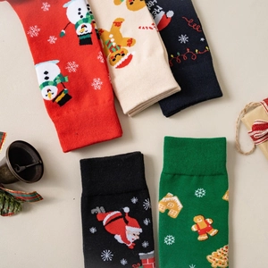Cartoon Christmas socks featuring snowman and Santa Claus patterns in festive colors