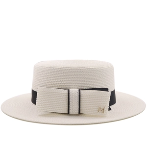 Flat top straw boater hat for women with black ribbon bow and metal M decoration