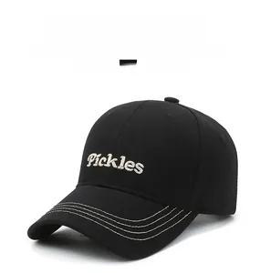 Close-up of black baseball cap featuring Pickles 3D embroidery and triple stitched brim