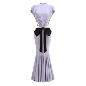 Detail of lavender mermaid dress featuring a large contrast black bow on the waist