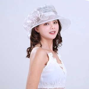 Detail of white organza sun hat featuring a large 3D flower and sheer mesh texture