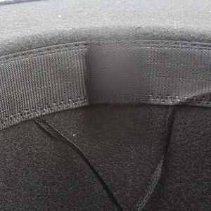 Black jazz hat inner label showing 65% cotton and 35% polyester material composition