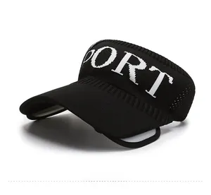 Detail of black breathable sun visor hat featuring a knitted white PORT letter logo design