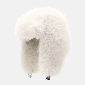 Detail of white faux fur winter trapper hat with fluffy texture and secure plastic buckle