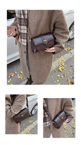 Close-up of vintage French shoulder bag with mixed-texture flap and metallic trim