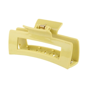 Pale yellow rectangular matte plastic hair claw clip with gold spring on white background
