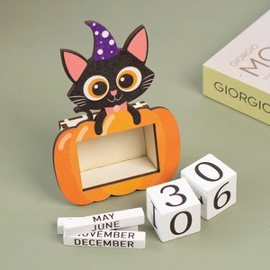 Macro view of Halloween wooden countdown calendar with cartoon black cat and pumpkin details